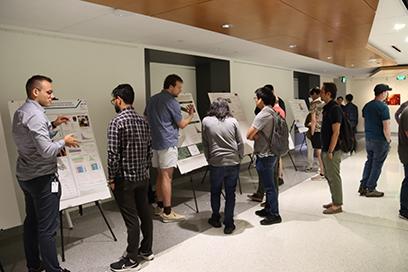 Participants of the 20th Exotic Beam Summer School (EBSS 2023) take part in a poster session.