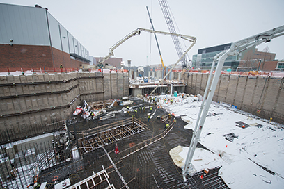 Workers place concrete for the linear accelerator tunnel foundation slab during the largest concrete placement of the entire FRIB Project, which took place March 3-4.