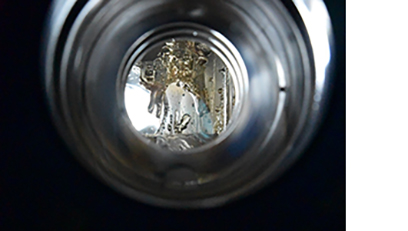 Melted liquid lithium is seen from the chamber view port. 