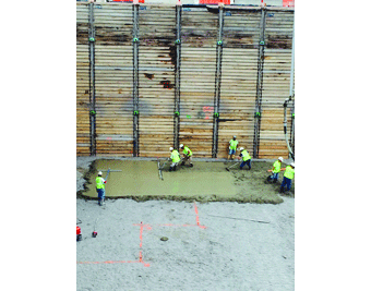 Workers pour the first concrete for the FRIB tunnel.