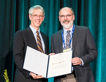 American Physical Society President Roger Falcone (left) presents Brad Sherrill (right) with the 2018 Tom W. Bonner Prize in Nuclear Physics. (Photo credit: APS|Ken Cole)