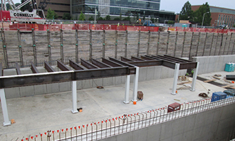 Workers install structural steel for the top of the linear accelerator tunnel. 