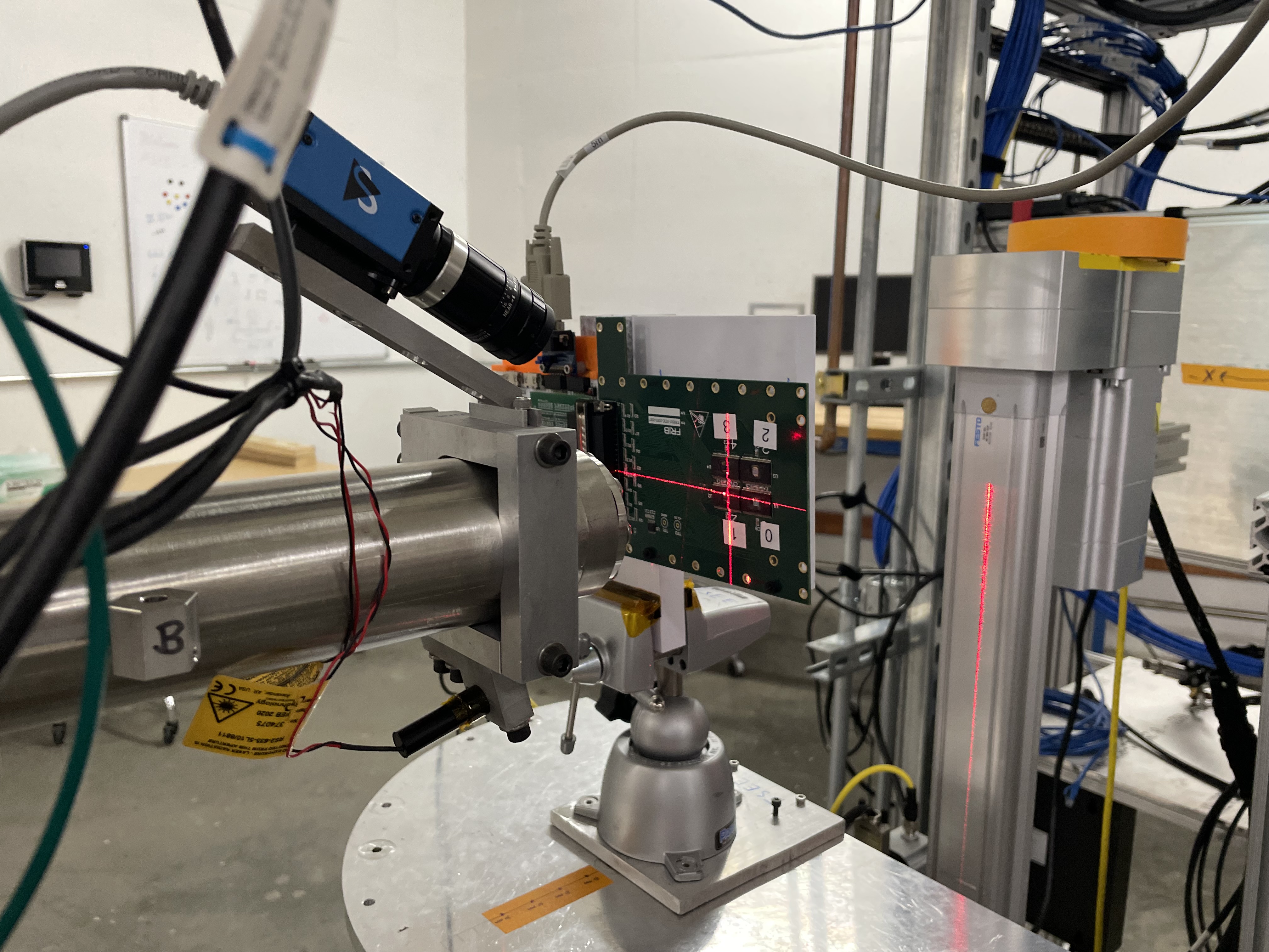 Photo of two line laser elements are provided to assist with aligning elements to the beam axis.